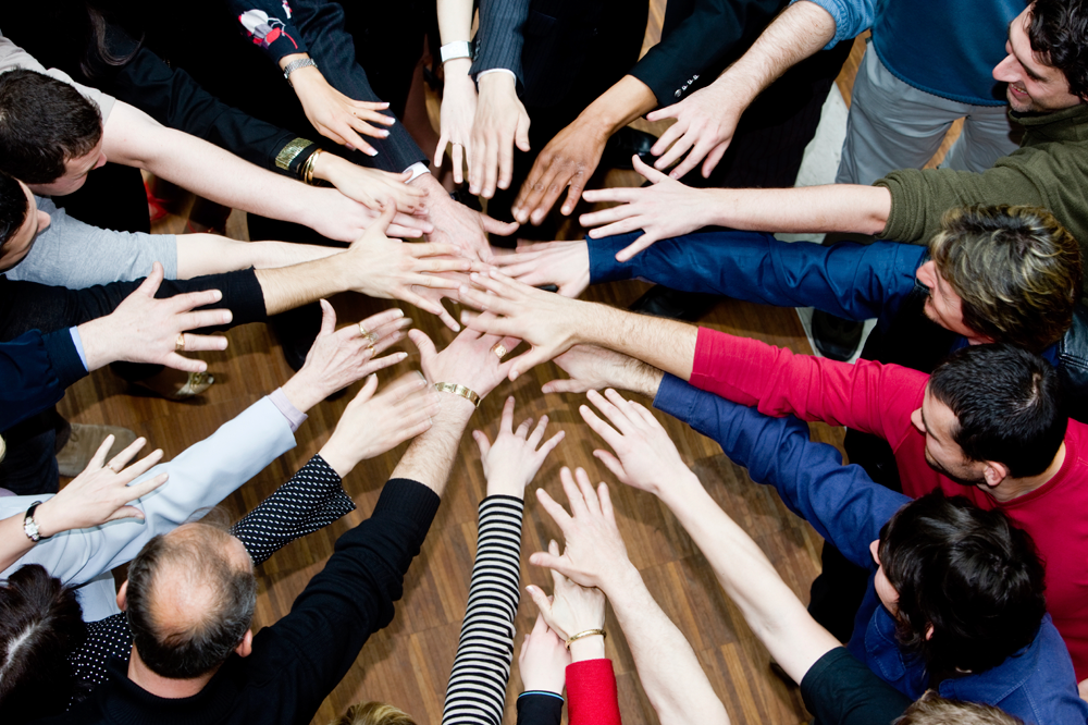 iStock_Hands-in-middle-business-team-Medium